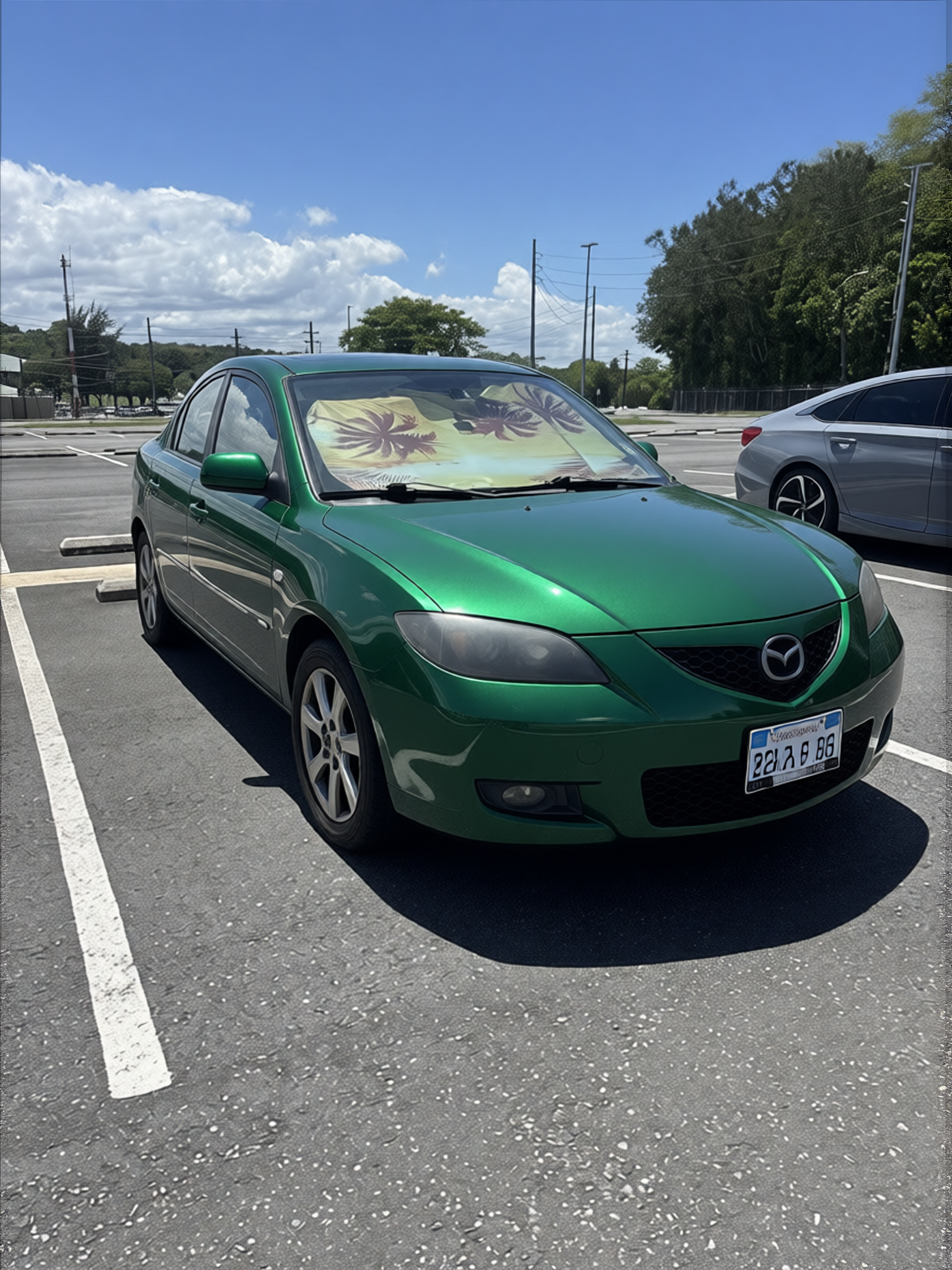 Mazda 3 rendered in Racing Green gloss paint